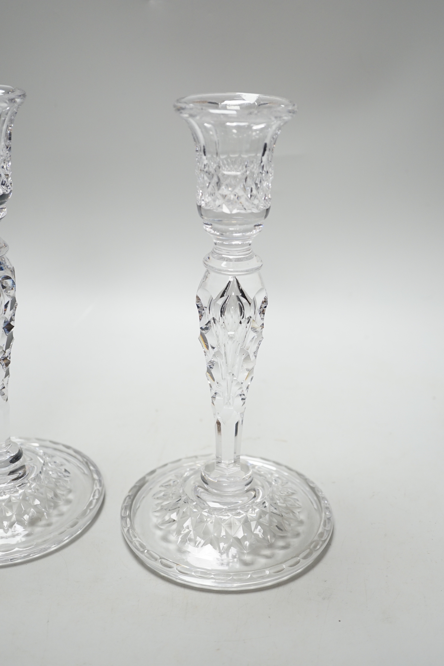 A pair of cut glass candlesticks, 25cm high